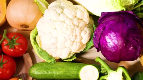 assorted vegetables arranged on a wooden table