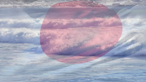 composición digital de la bandera de japón ondeando contra la vista aérea de las olas en el mar