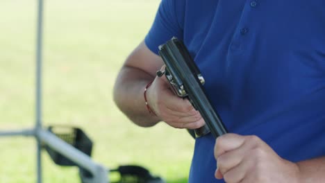 sportsman shoots from a double-barreled shotgun, a sports field for a shooting test is shooting at flying skeet