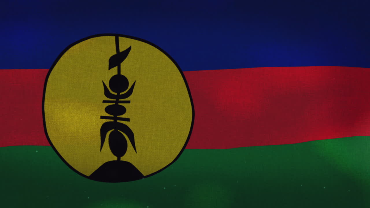 la bandera nacional de nueva caledonia ondeando
