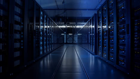 rows of servers in a data center with blue lights