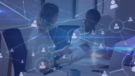 animation of connections with digital icons over diverse businesswomen in office