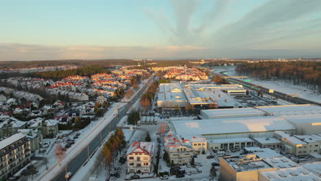 golden sunrise in suburb of polish city in winter