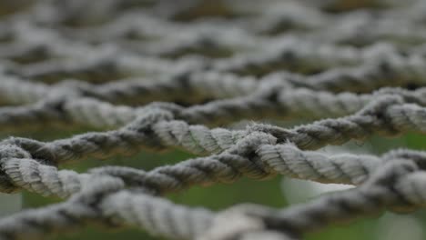 tightly woven rope pattern outdoors, close-up shot with a soft focus