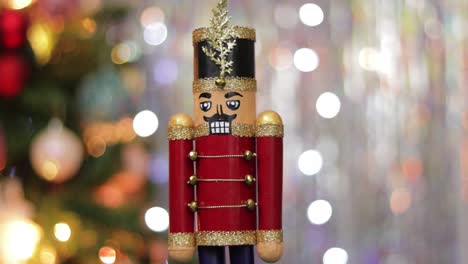 toy soldier nutcracker decoration on bokeh christmas lights background