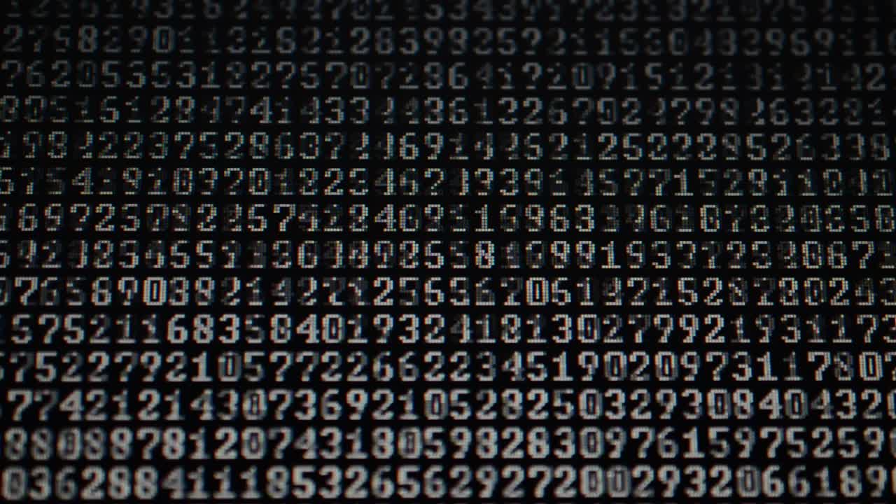 Binary code on the monitor screen. Shooting of a binary code, background