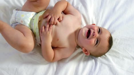 Cute-baby-laughing-and-lying