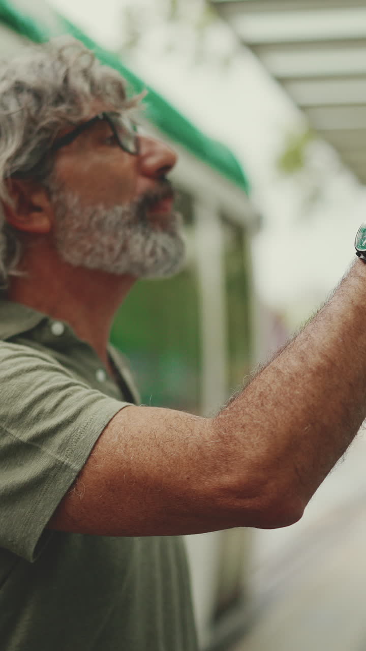 Portrait of a man with gray hair and beard