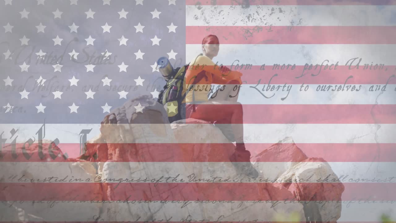 анимация американского флага и текста, движущаяся над женщиной, сидящей на скале