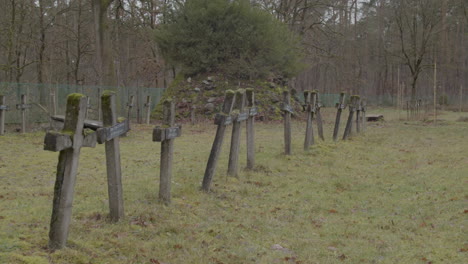 panning over old and crooked crosses at graveyard