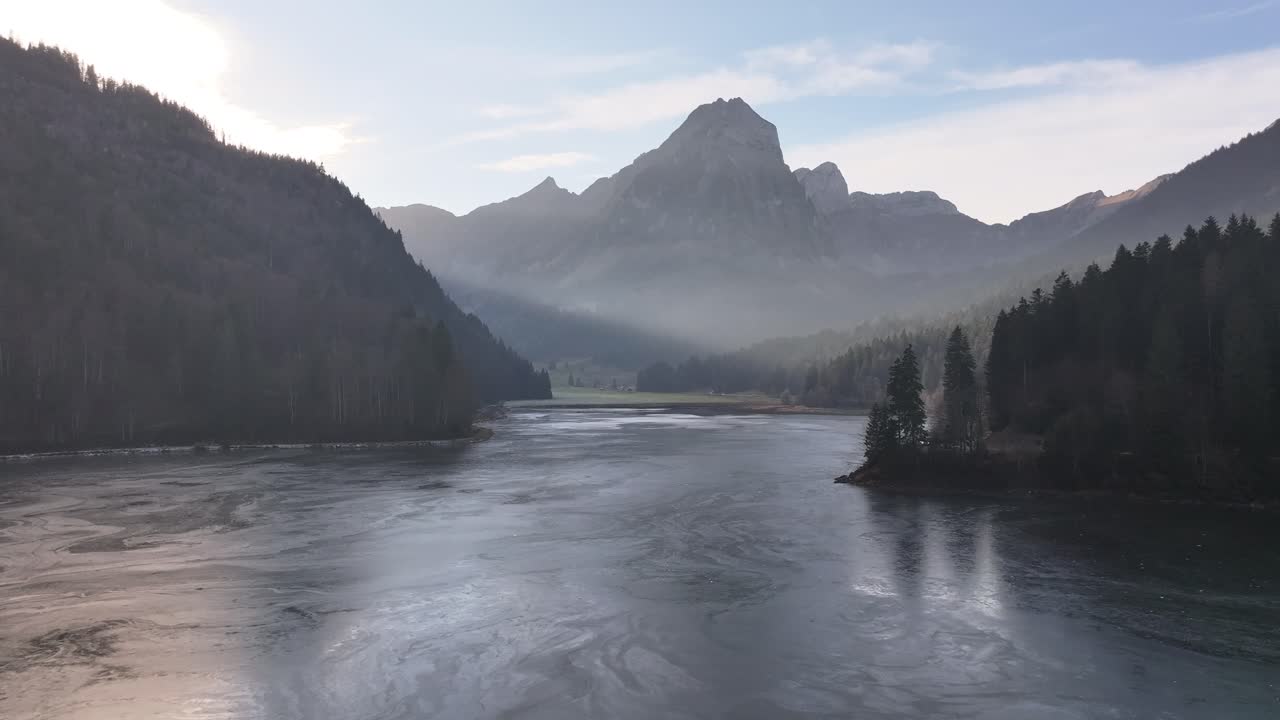 Aerial view of Obersee lake, Näfels, Glarus, majestic Swiss alps and reflective waters.