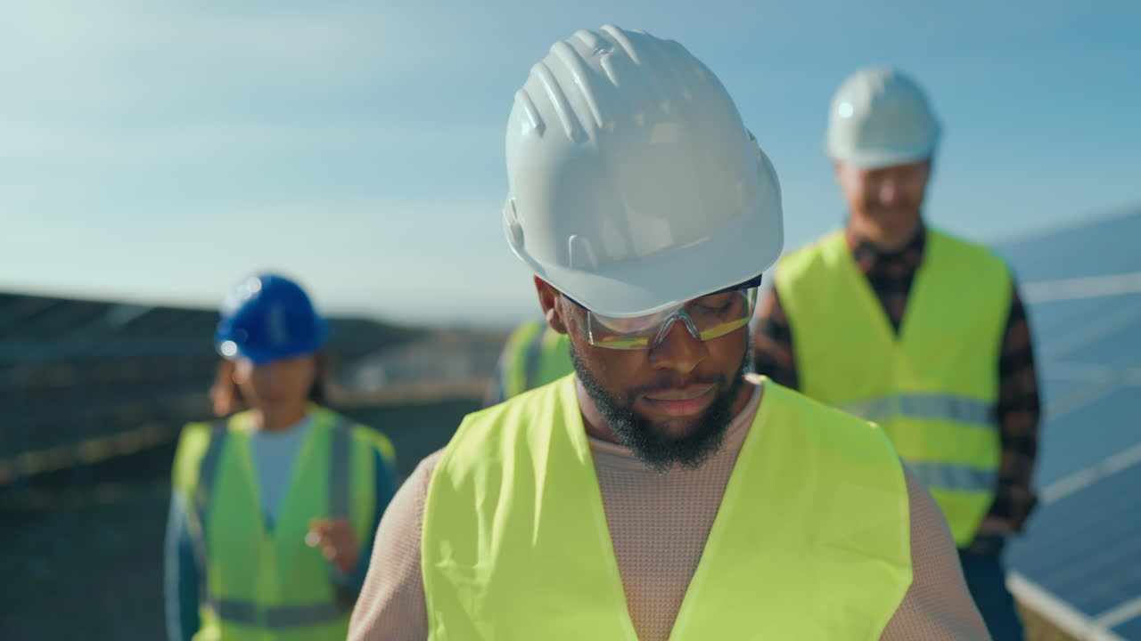 Engineers Inspecting Solar Panels