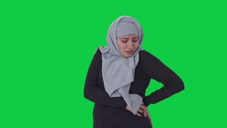 Sick-Muslim-woman-suffering-from-Back-pain-Green-screen