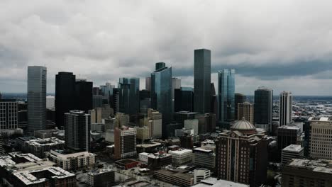 Drone-shot-pulling-away-from-the-Houston,-Texas-skyline