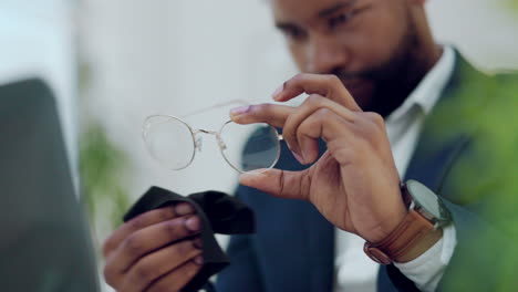 hands of man cleaning glasses