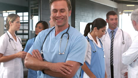 smiling doctor posing with crossed arms