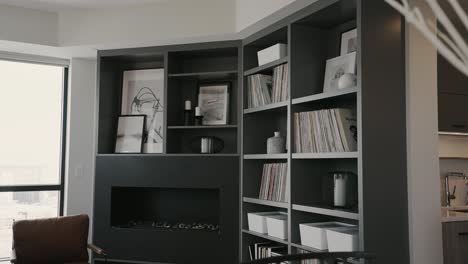 shelves-with-modern-decorations-within-the-family-room-of-a-modern-home