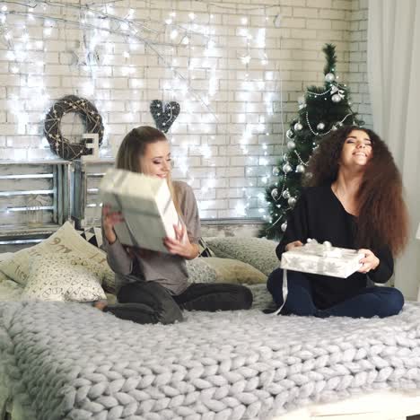 women with christmas gift boxes