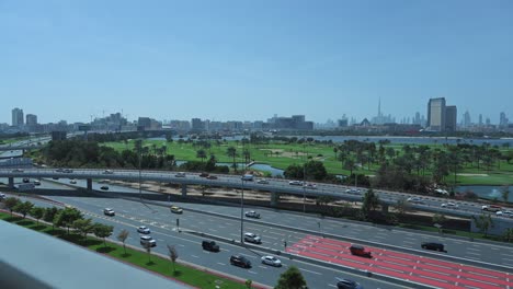 dubai skyline from deira with traffic on airport road, united arab emirates