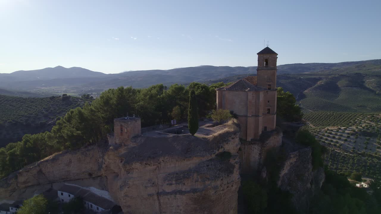 Montefrio. Church next to cliff. Aerial view of Andalusian town and church on cliff. Village Church. Iglesia de la Villa. Montefrio. Andalusia. Spain.