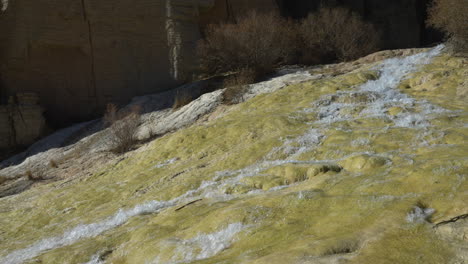 Spring-Water-Flowing-Down-From-Rock-Mountains-At-Band-e-Amir-National-Park,-Bamyan-Province,-Afghanistan