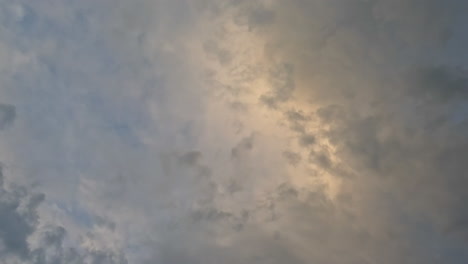 Airplane-flies-overhead-against-sunset-sky