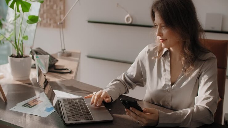 Businesswoman Working at a Modern Office Desk