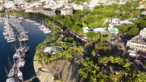 papeete, tahiti island, french polynesia. aerial view of coastal traffic, buildings and marina
