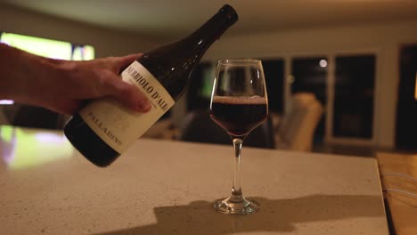 sequence of pouring red wine into a glass