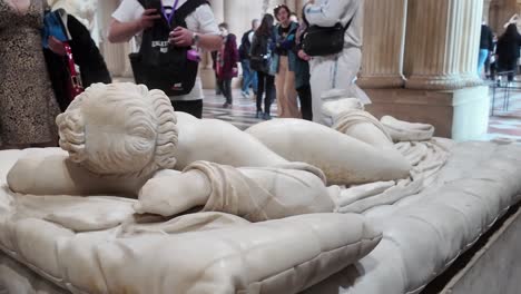 reclining marble statue at the louvre museum