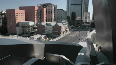 traffic drives past downtown office buildings