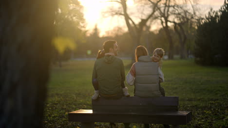 family enjoying sunset in the park