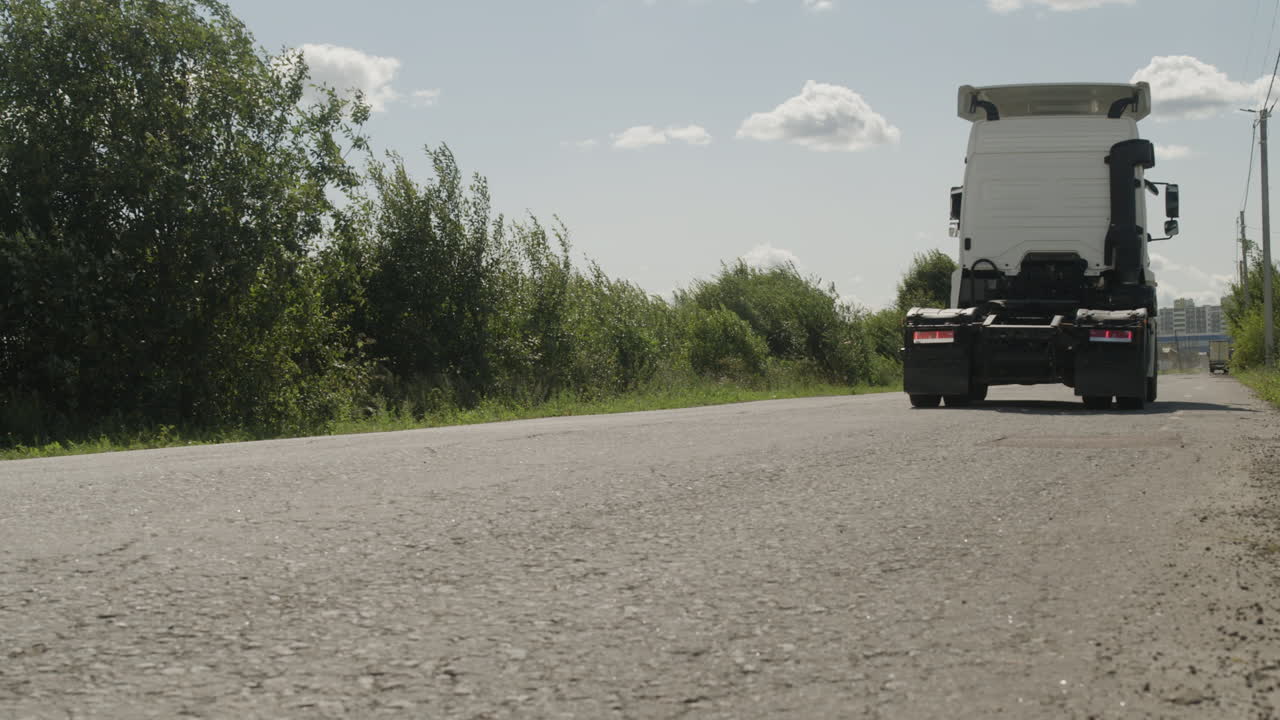 A truck travels on a road