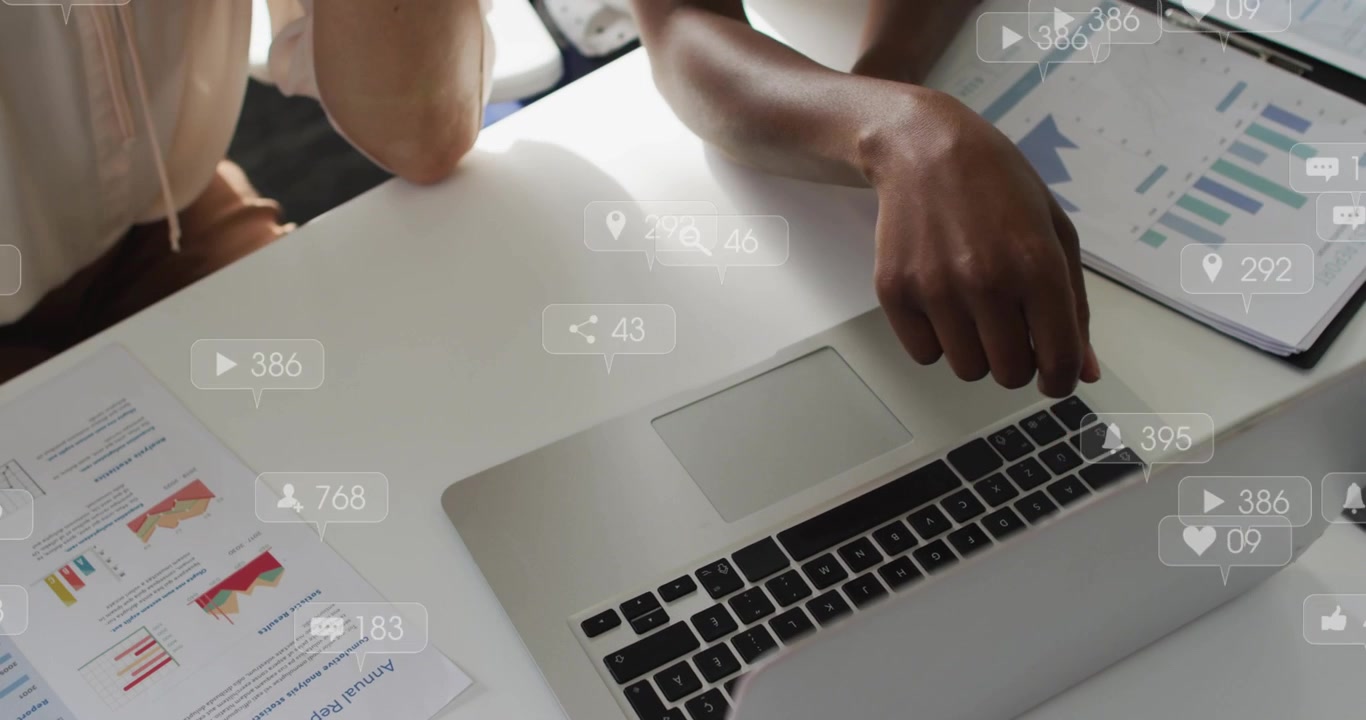 Two women working laptop, right finger pointing sparking likes over charts showing business ROI