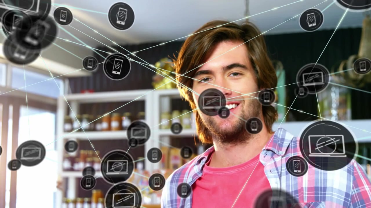 Animación de iconos tecnológicos conectándose con líneas, joven caucásico hablando por teléfono en una tienda