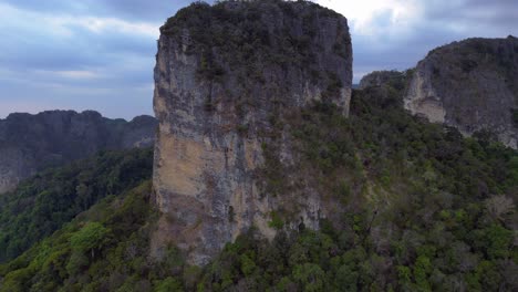 rai leh beach towering limestone cliffs emerging from tropical forest in krabi, thailand. lovely aerial view flight overflight flyover drone