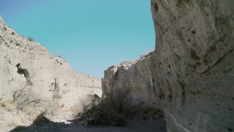 Closeup-view-of-weathered-sandstone-cliffs-and-dry-riverbed-in-Tuff-canyon-texas