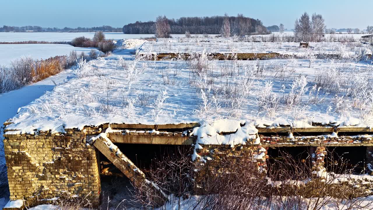 Old Farm Abandoned Building Covered With Snow. - aerial shot