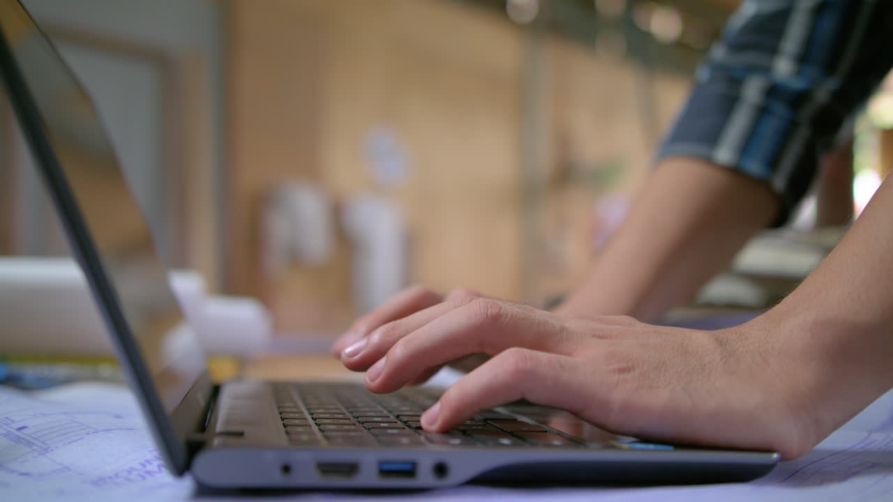 Side Shot Of An Architect Typing 4K