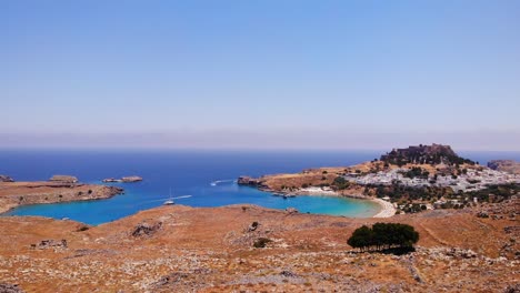 scenery of rhodos island at aegean sea with whitewashed village of lindos in greece - aerial drone shot