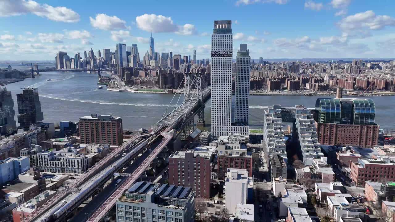 Horizontal drone hover shot over Wythe Avenue in Williamsburg, Brooklyn, capturing a steady aerial view of New York’s vibrant cityscape, historic buildings, and urban streets.