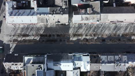 AERIAL:-Top-View-Shot-of-Laisves-Avenue-with-Cars-Driving-and-People-Walking