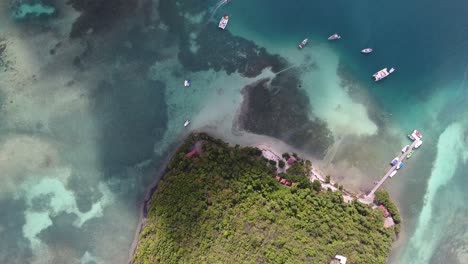 aerial drone shot during sunny afternoon. view from top of a beautiful island su