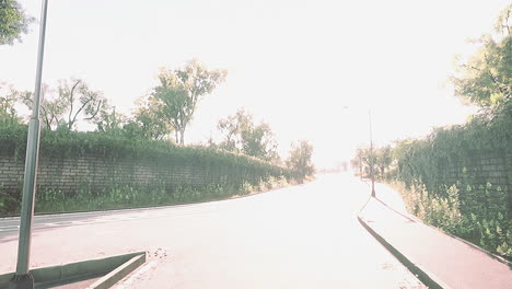 Empty-asphalt-road-and-beautiful-view-of-cityscape-on-sunny-day