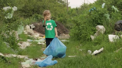 Volunteer-girl-cleaning-up-dirty-park-from-plastic-bags,-bottles.-Reduce-trash-nature-pollution