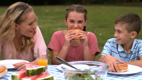 smiling girl eating hamburger