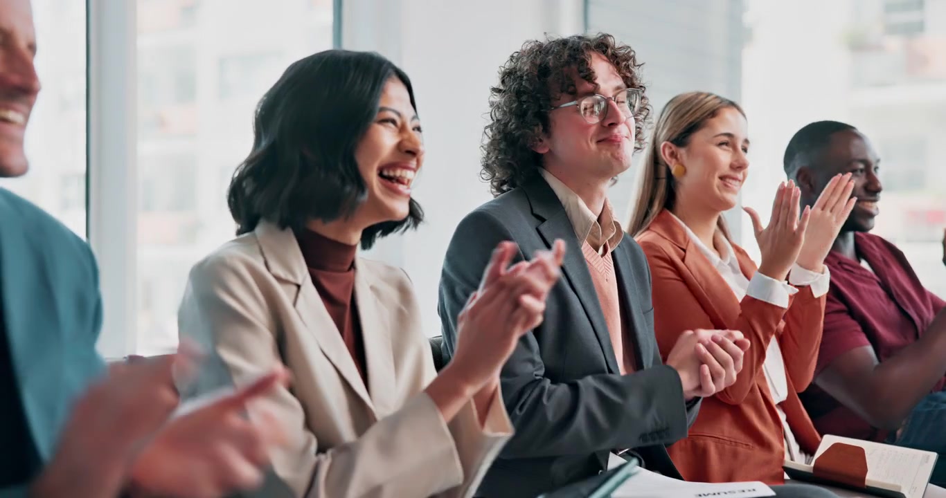 Diverse Group of Professionals Applauding During a Business Meeting