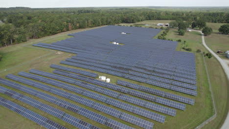 Drone-over-solar-farm,-photovoltaic-solar-energy