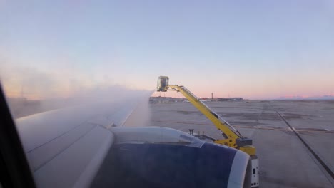 De-icing-a-commercial-airplane-on-the-runway