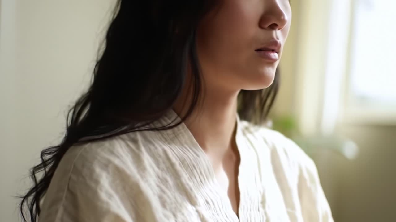 A Serene Moment of Reflection: Capturing the Essence of Inner Peace and Contemplation in a Calm Setting with Soft Light and Gentle Expressions